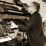 Paul Zawadzki from side playing keyboards