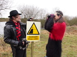 Jean Devalive and Paul Zawadzki on Bungay Common by no swimming sign in winter