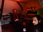 Jean Devalive and Paul Zawadzki in red tinted recording studio
